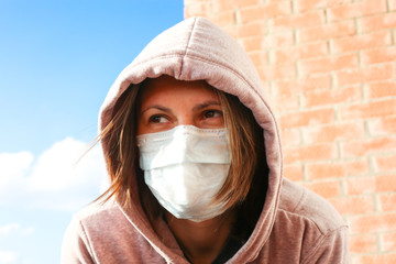 Corona Virus concept. Woman wearing face mask at the street. The concept of the epidemic of the...