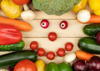 Frame for designer made of vegetables on a wooden background view from the top