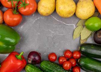 Frame for the designer of vegetables on a marble background top view