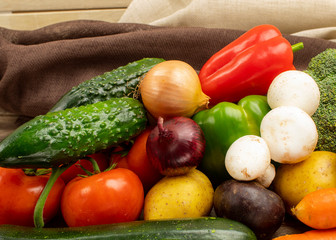 Homemade vegetables on a wooden background view from the side