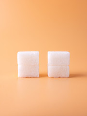 close up look to two white sugar cubes