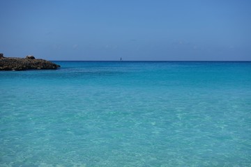 Fototapeta na wymiar View of a beach on the blue Caribbean Sea in Saint Martin (Sint Maarten), Dutch Antilles
