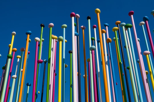 Colorful poles against blue sky, the sculpture named Coloris, in the public park at City Life district, new residential area, in Milan, Italy, March 8, 2020
