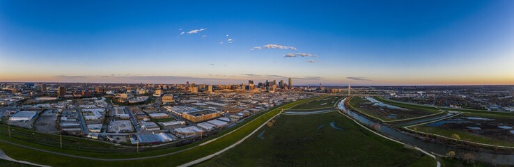 Panoramic aerial drone picture of Dallas skyline and Trammel Crow Park at sunset in winter