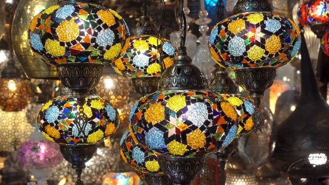 Many hanging colorful turkish lamps as a background in 4K.