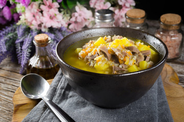 Polish barley soup with vegetables and chicken heart.