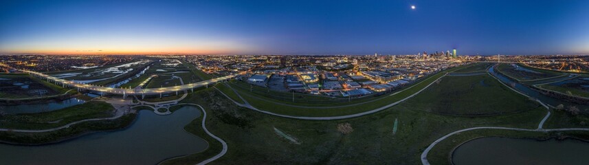 Panoramic aerial drone picture of Dallas skyline and Trammel Crow Park at sunset in winter