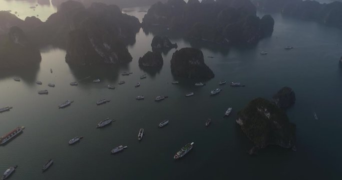 Aerial view of royalty high quality free stock footage over natural rocks green tops Halong bay, Titop island area and sea blue azure water. Wild natural untouched seascape. Asia Vietnam.