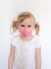 Girl in face mask.Child wear facemask for protect during coronavirus and flu epidemic.Virus and illness protection.Safety breathing masks.Coronavirus flu virus concept.Health care and medical concept.
