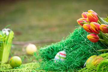 Colorful Easter eggs decorated with flowers in the grass background