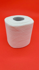 Toilet paper on a red background