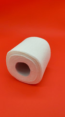 Toilet paper on a red background