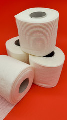 Toilet paper on a red background