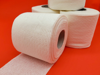 Toilet paper on a red background