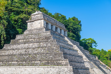 Fototapeta na wymiar Side view of the Mayan Temple of Inscriptions in Palenque located in the rainforest of Chiapas, Mexico.