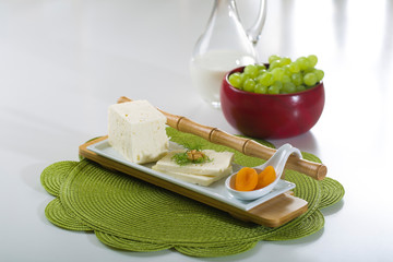 Feta cheese on white plate with copy space