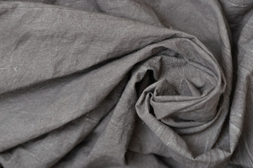 Crumpled fabric texture, dark gray cloth background. Copy space