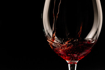 red wine glass on dark background