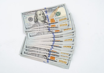 Stack of american dollars. Close-up on white background
