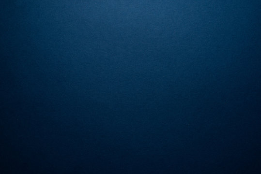 Empty dark blue background. Dark blank with a slight glow.