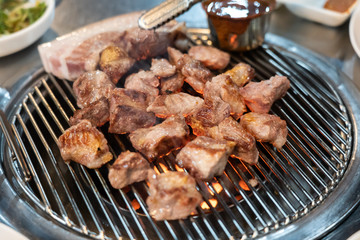 Preparing Traditional Korean Barbecue Grill Pork.