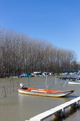 Fishing boats on the river side on a beautiful sunny day