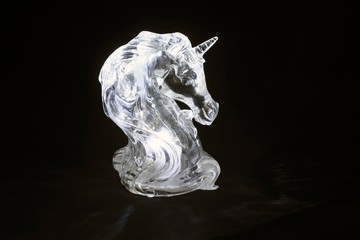 unicorn statuette glowing in the dark