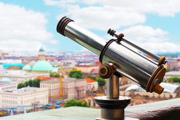 Obraz na płótnie Canvas Stationary monocular telescope on the top of the Berlin Cathedral in Berlin, Germany. Tourist monoscope on the observation deck, panoramic cityscape. Aerial view of Berlin from the top of Berliner Dom