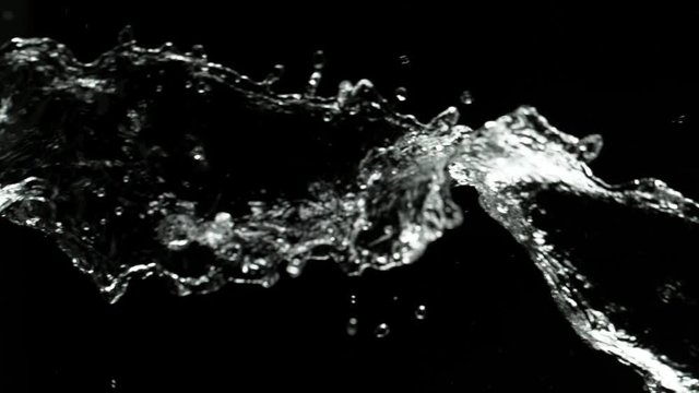 Super slow motion of splashing water rotation isolated on black background. Filmed on very high speed camera, 1000 fps.