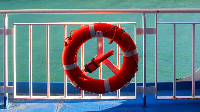 Water wheely a life saving buoy on guard railing of a cruise ship