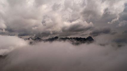 mountain peaks in the clouds