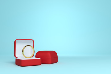 red box with a gold wedding ring on a blue background with copy space. love. relations. wedding. 3d rendering