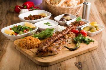 traditional turkish  adana  kebap meal  with garnitures