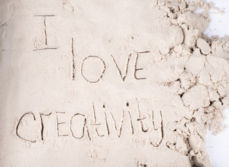 Text written in sand, kinetic sand