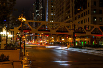 Chicago, night traffic between bridges and skyscrapers