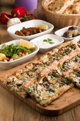 turkish mushroom pide on wooden table