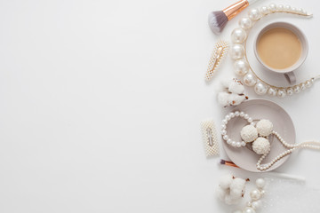 Wedding background, decorated with decorations for the bride's dress, white feather, cotton flower, pearl hairpins, around the text space, all in pastel colors. Concept preparation for the wedding