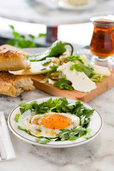 fried egg with cheese on marble