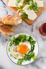 fried egg with cheese on marble