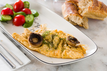 scrambled eggs with mushroom tomato and cucumber