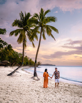 Saint Lucia Caribbean Island, couple on luxury vatation at the tropical Island of Saint Lucia, men and woman by the beach and crystal clear ocean of St Lucia Caribbean Holliday