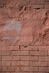 Vertical vintage texture of a cemented brick wall
