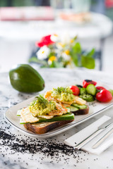 Healthy breakfast toast with avocado and cheese