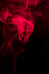 Obraz premium Red smoke on black background