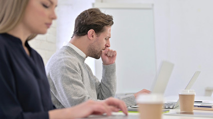 Obraz premium Creative Woman Working on Desktop and Coughing in Office