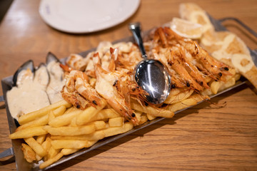 Seafood on the plate with sauce in restaurant