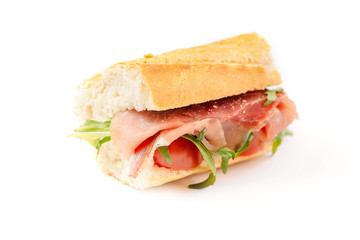 sandwich with arugula and prosciutto isolated on white background