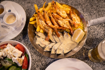 Seafood on the plate with sauce in restaurant