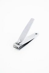 Single metal silver nail clipper macro close up shot isolated against white