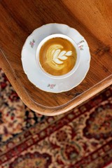 Flat lay barista latte art coffee cappuccino with roasted robusta coffee beans